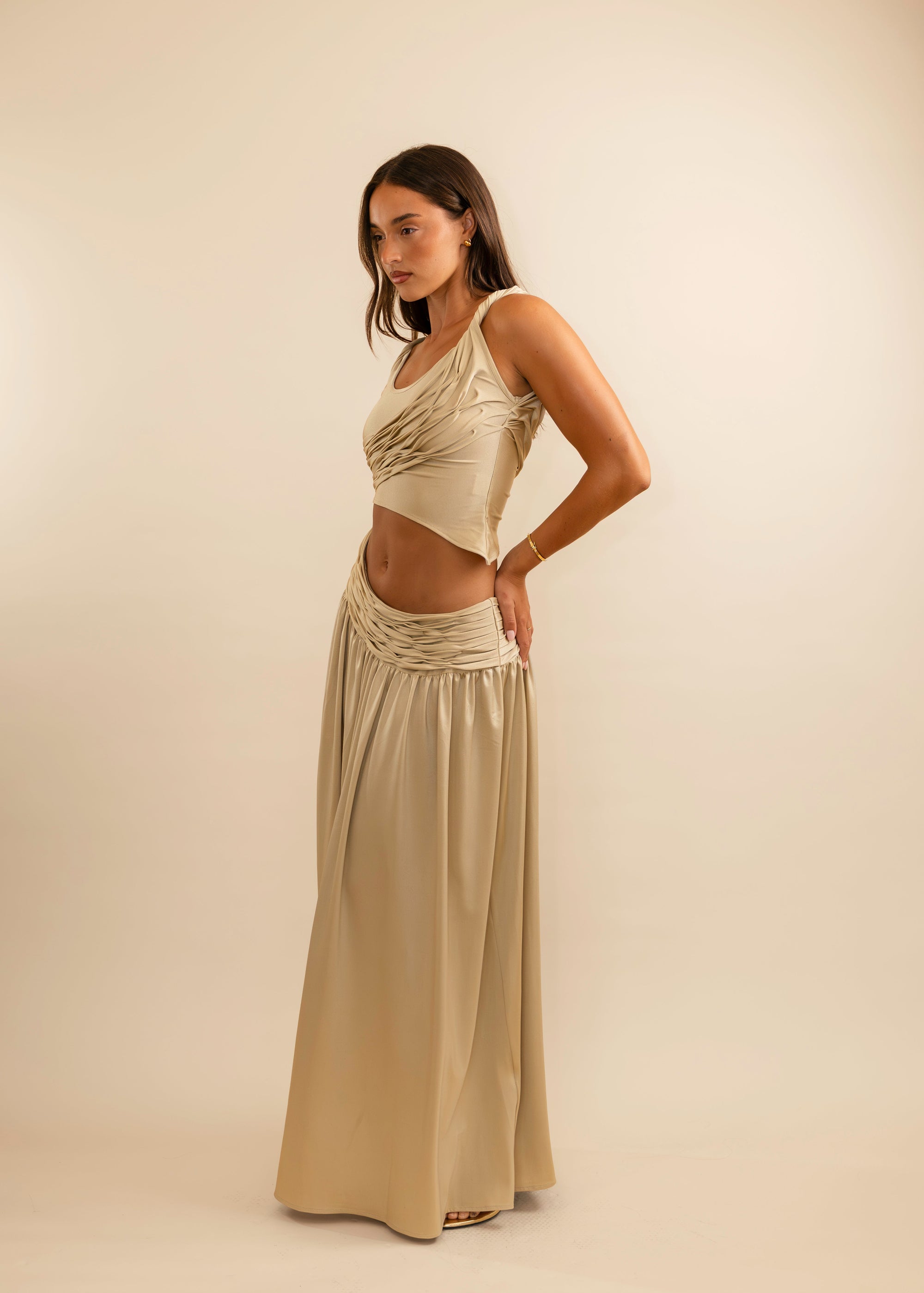 gold top and skirt draped