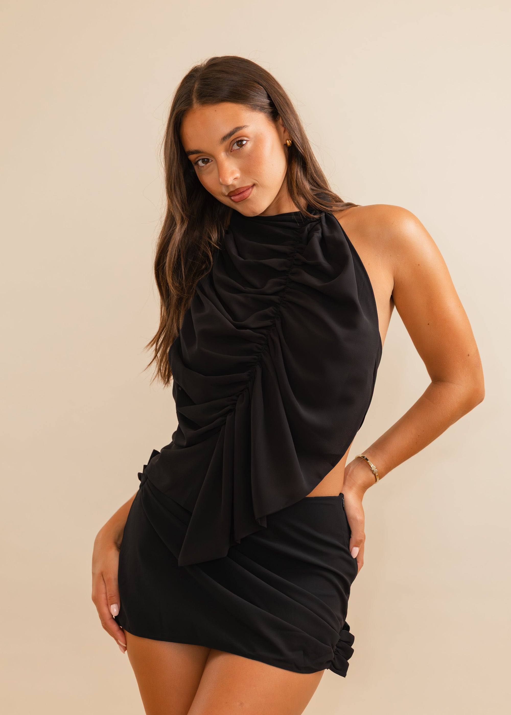black ruched top and mini skirt set