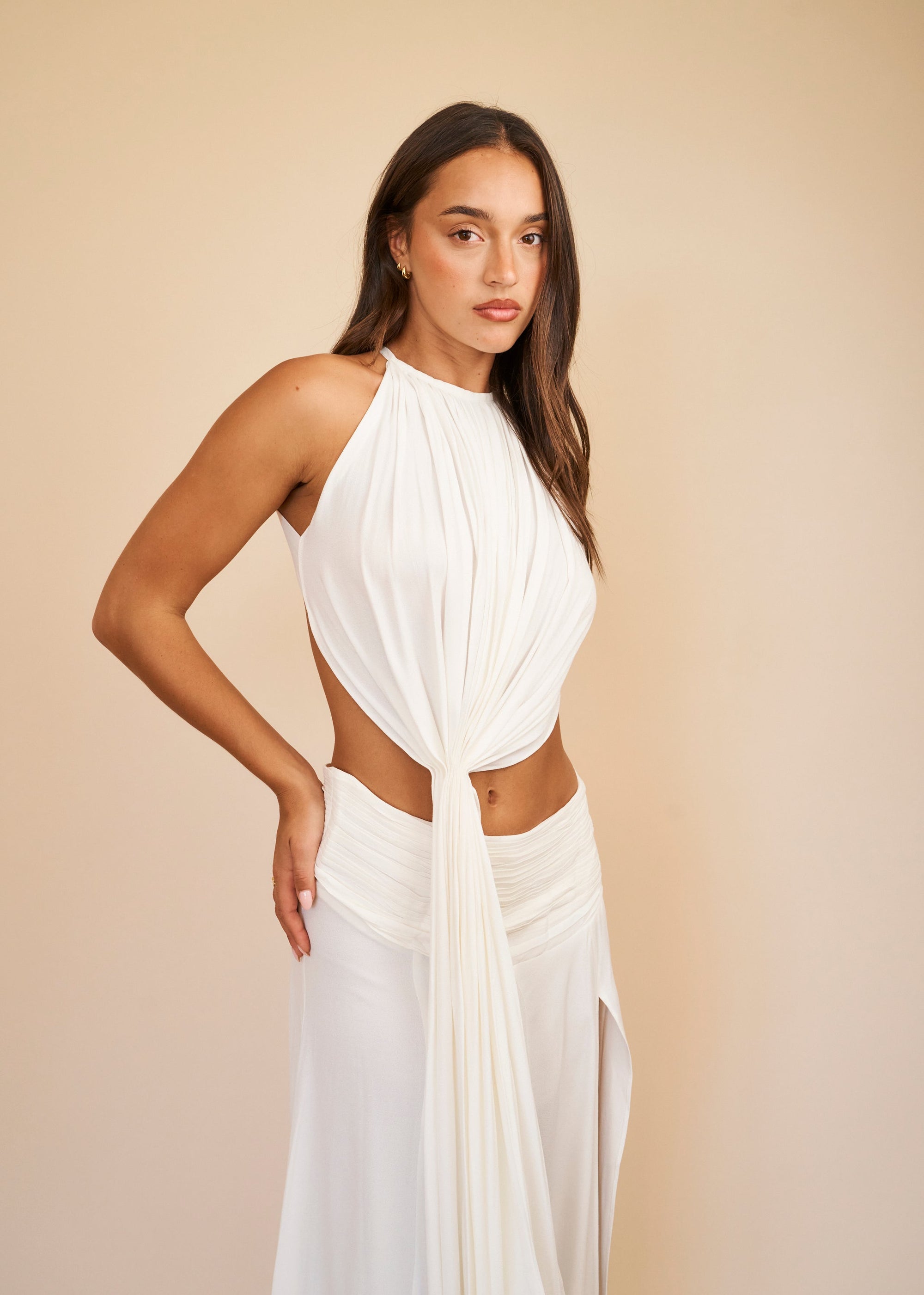 White halter neck top with soft pleated draping and front tie detail